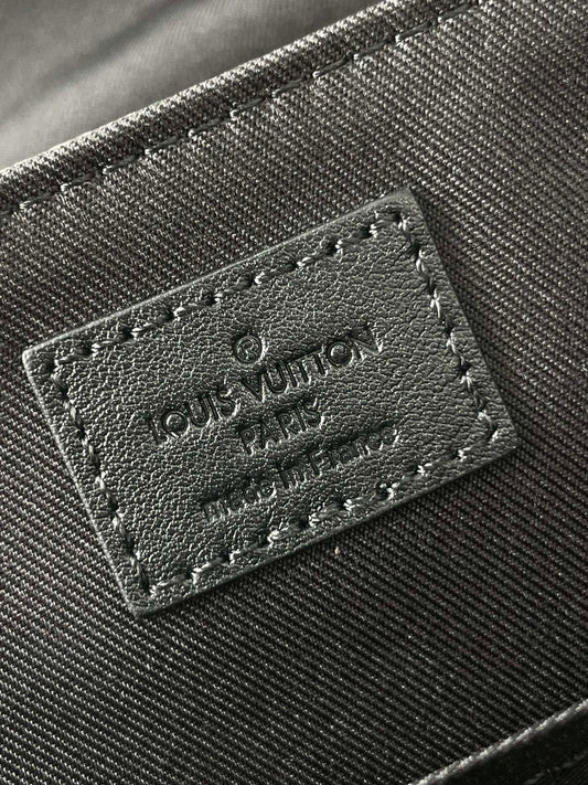 MESSENGER VOYAGER PM 33 IN GUN METAL MONOGRAM ECLIPSE CANVAS