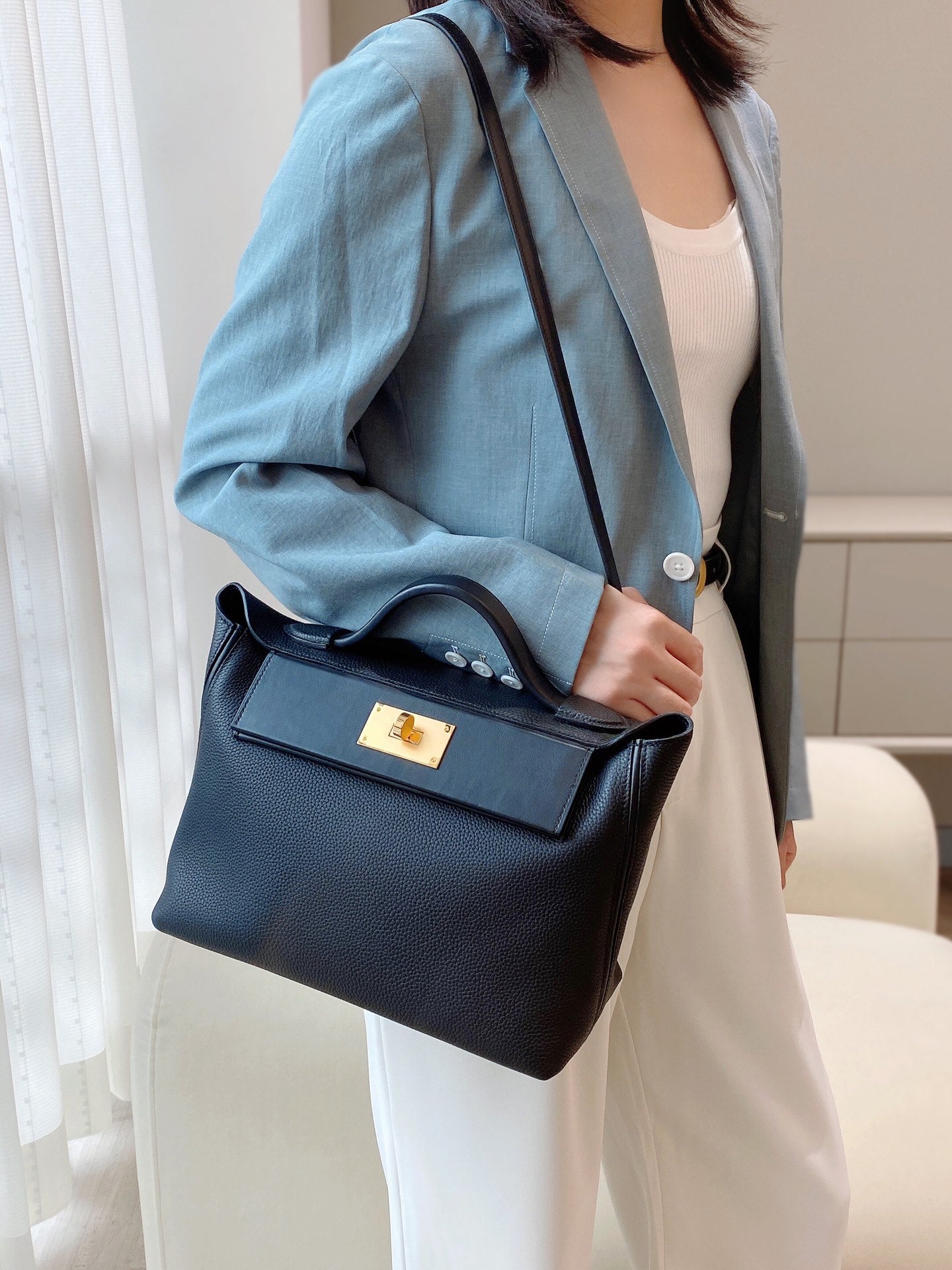 MINI 24/24 29CM IN BLACK EVERCOLOR CALFSKIN GOLD KELLY BUCKLE