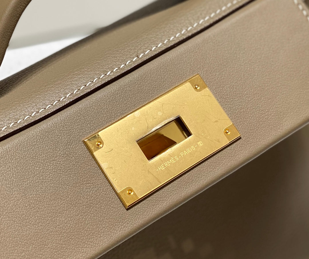 MINI 24/24 21CM IN TOGO ETOUPE EVERCOLOR CALFSKIN GOLD KELLY BUCKLE