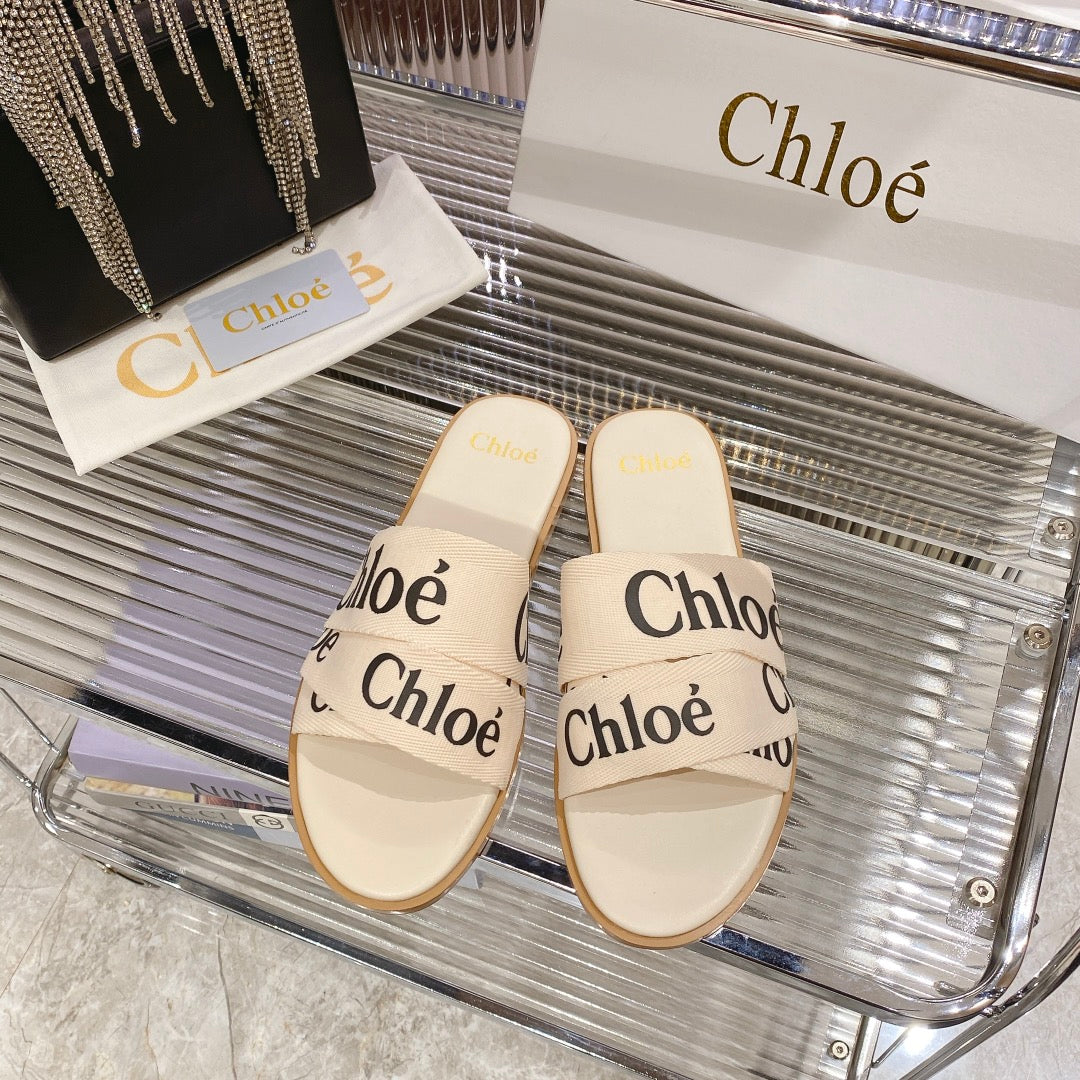 WOODY SLIPPER IN BEIGE MIX BLACK CANVAS