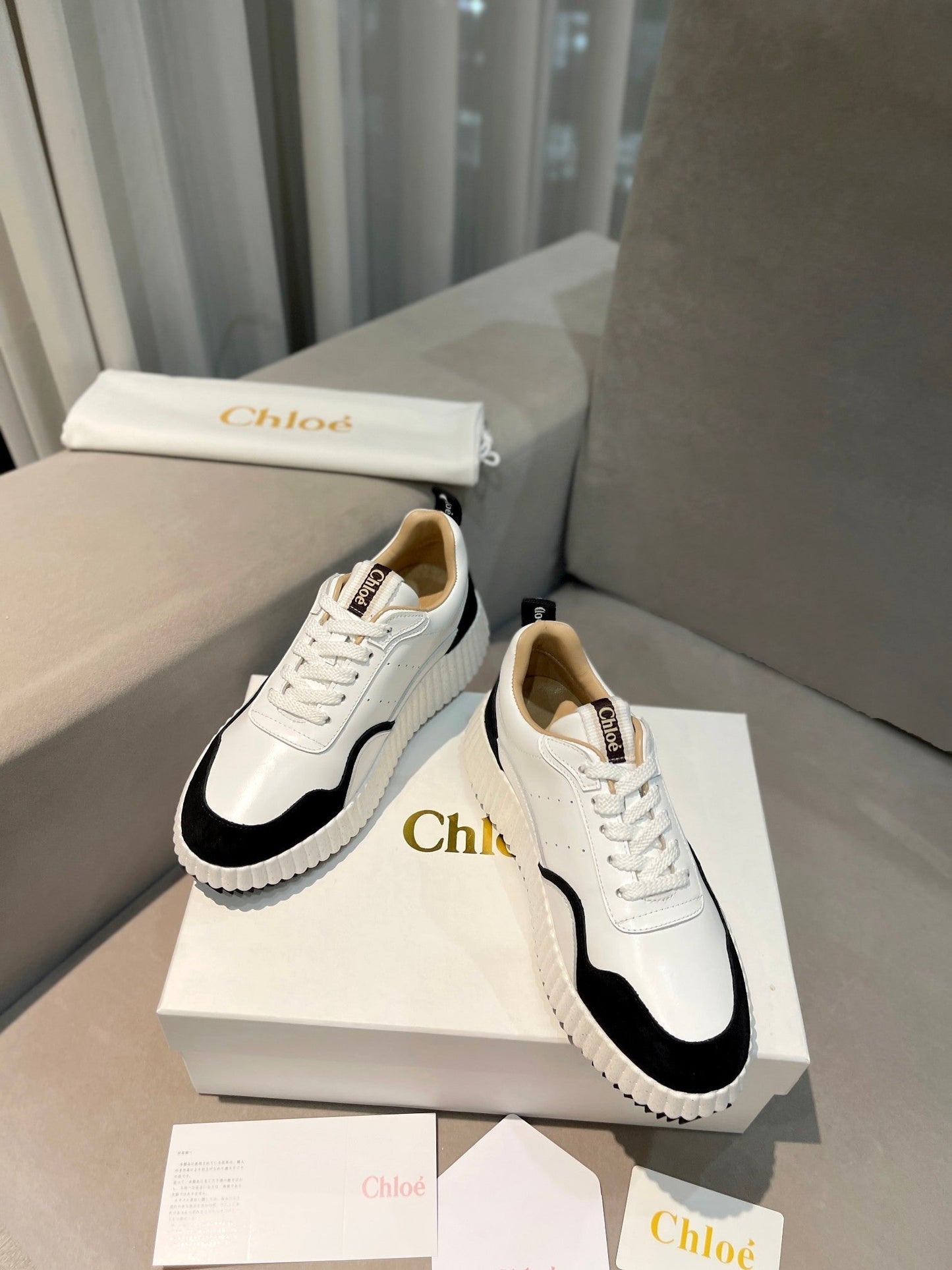 NAMA SNEAKER IN WHITE LAMBSKIN AND BLACK SUEDE