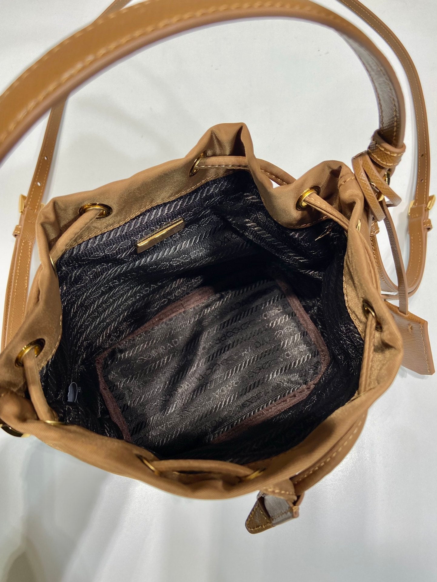 BUCKET BAG 19 IN RUSSET BROWN RE-NYLON AND CALFSKIN HANDLE