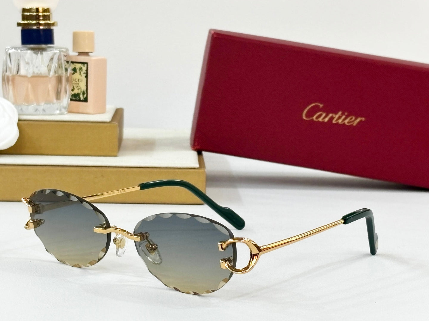 C DE RIMLESS ROUND FRAME SUNGLASSES CT0599S IN METAL