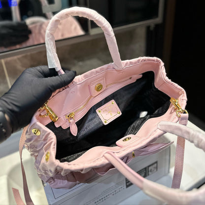 BOW DETAIL RUCHED TOP HANDLE BAG 29 IN LIGHT PINK SAFFIANO LEATHER