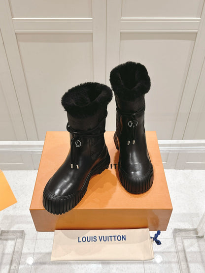 RUBY FLAT ANKLE BOOT IN BLACK CALFSKIN AND MONOGRAM NYLON