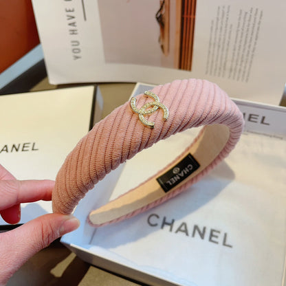 LIGHT PINK FABRIC HAIRBAND WITH GOLD LOGO 414436