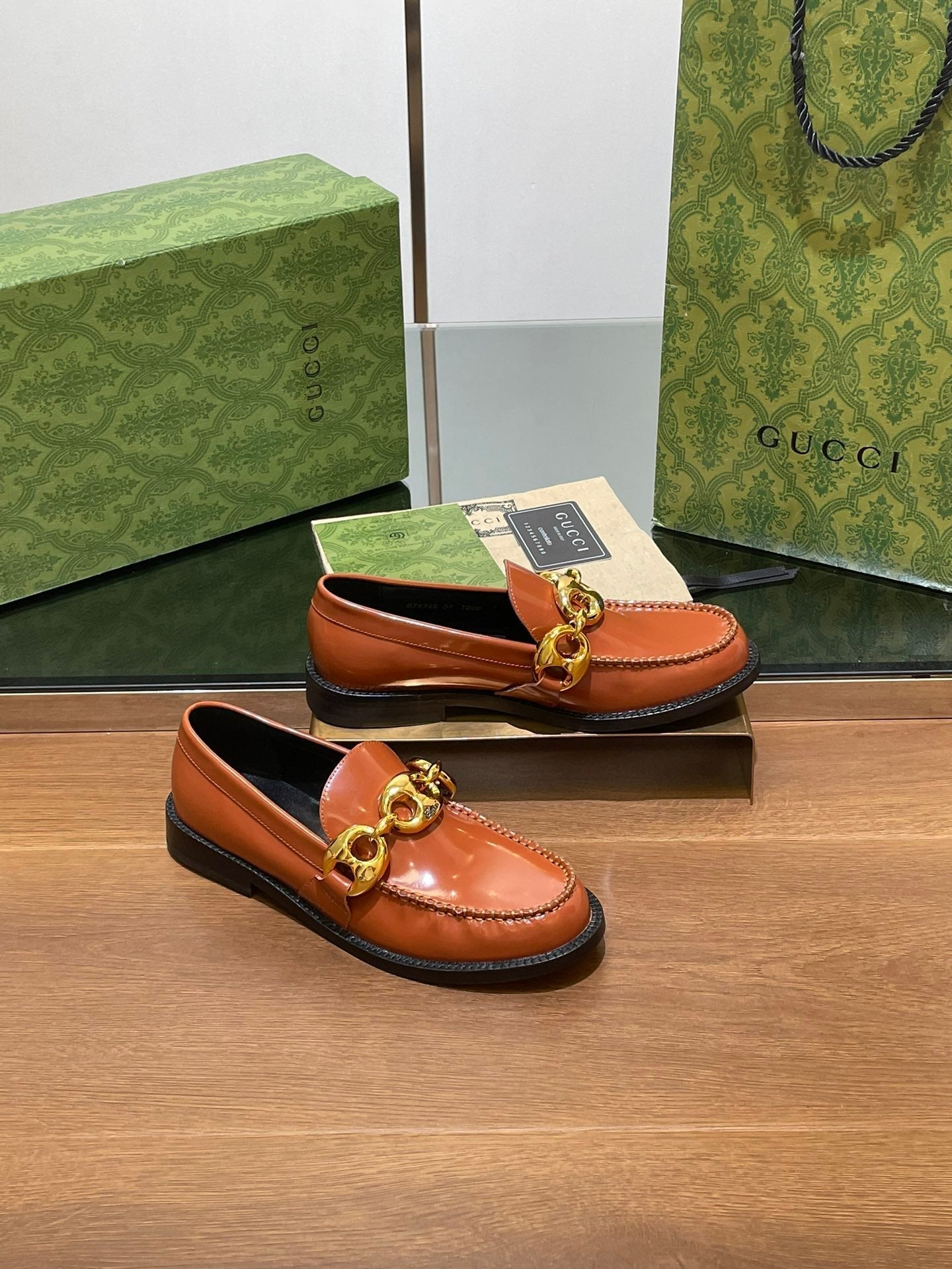 GG LOAFER SHOES IN BRONZE BROWN CALFSKIN WITH GOLD HARDWARE