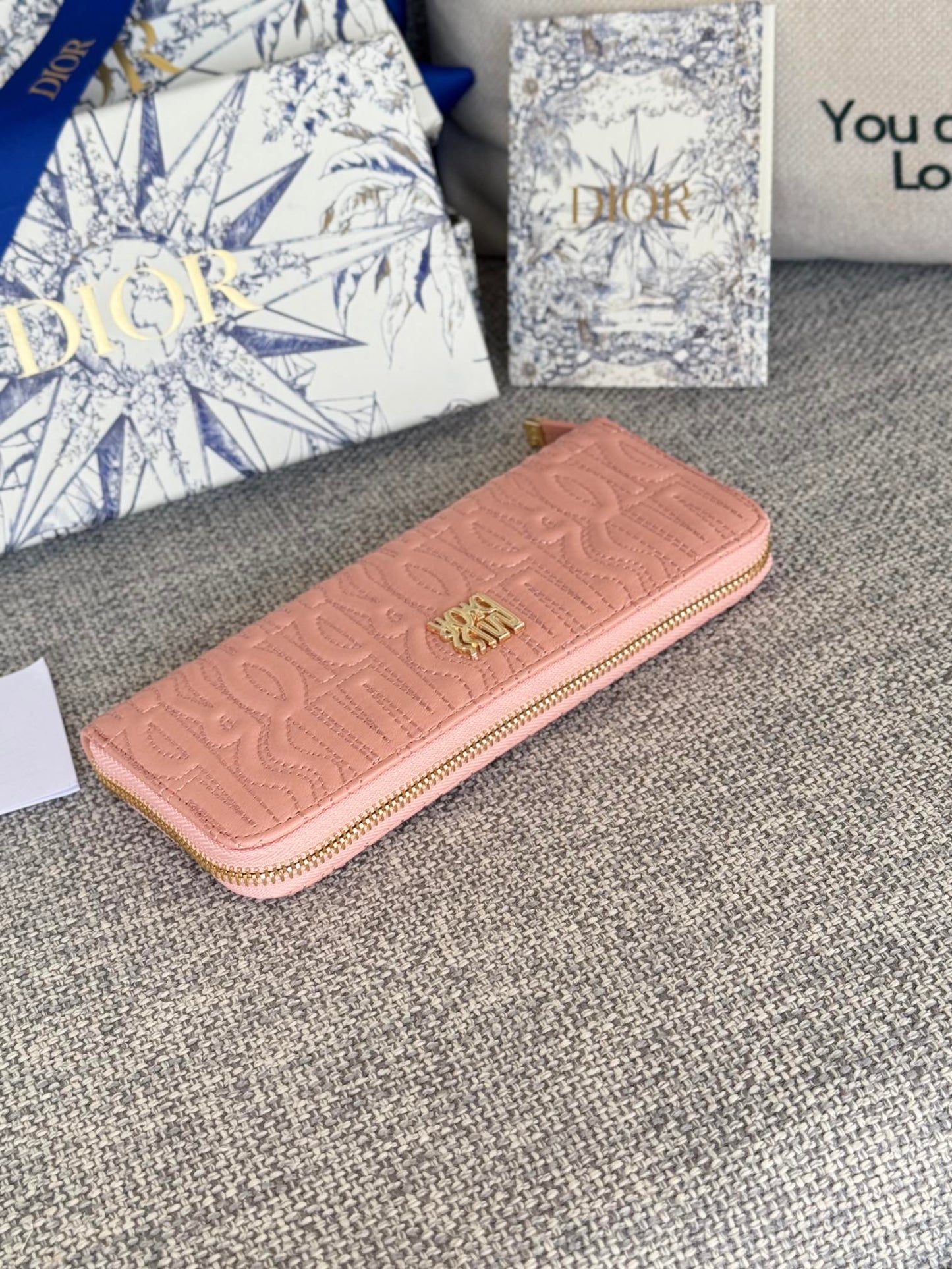 VERTICAL LONG ZIP WALLET 20 IN BABY PINK QUILTED ALLOVER CALFSKIN