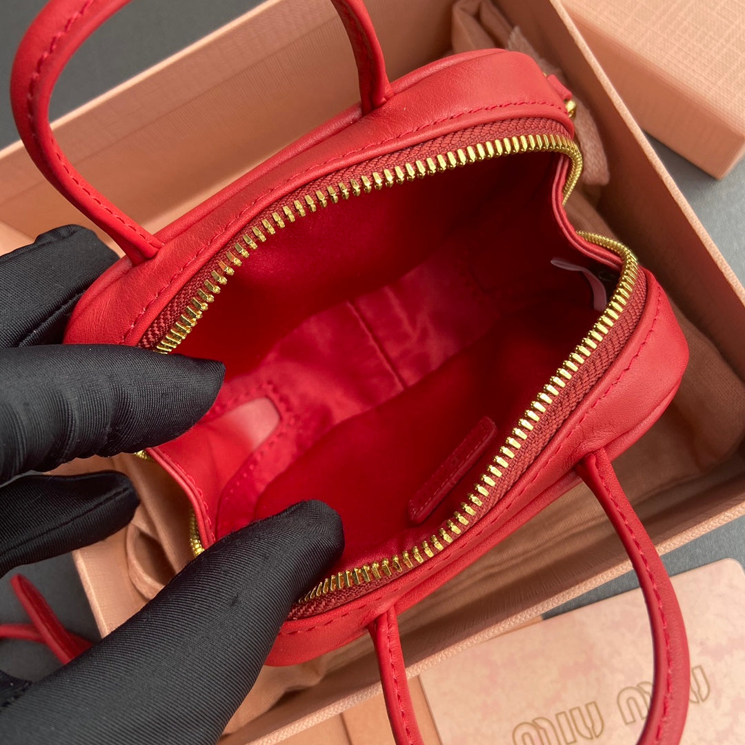 MICRO BAG KEYCHAIN 11 IN TALL POPPY RED CALFSKIN EMBOSSED LOGO